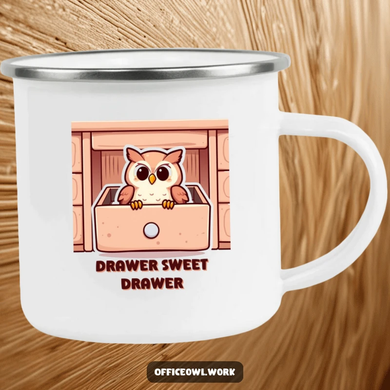Funny camping mug showing a content owl snuggled inside a stylized desk drawer, ready for outdoor excursions.