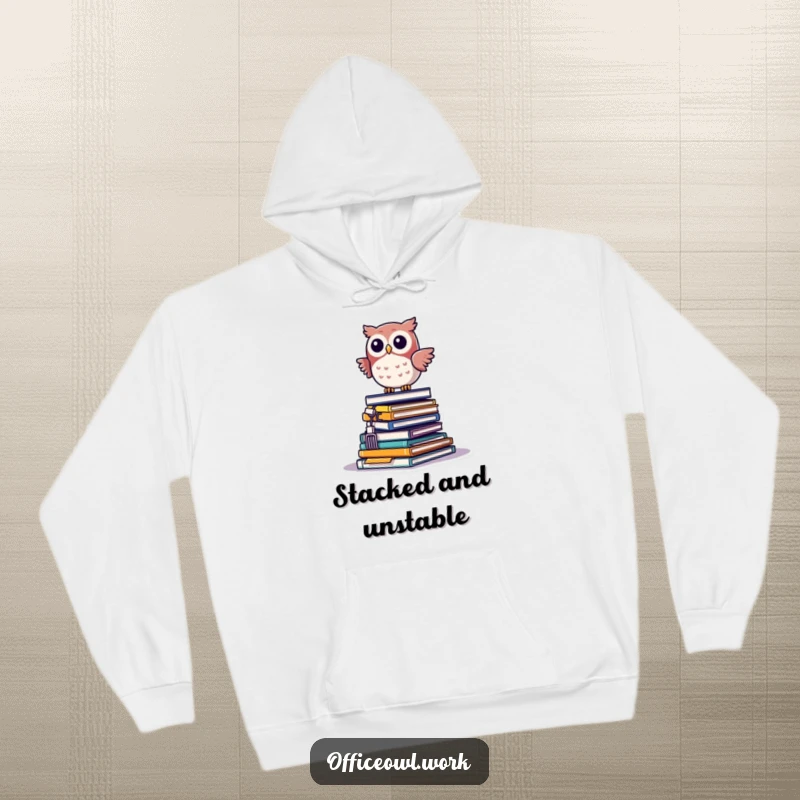 Funny kawaii owl precariously balancing on a teetering pile of office supplies, featured on a cozy hoodie.